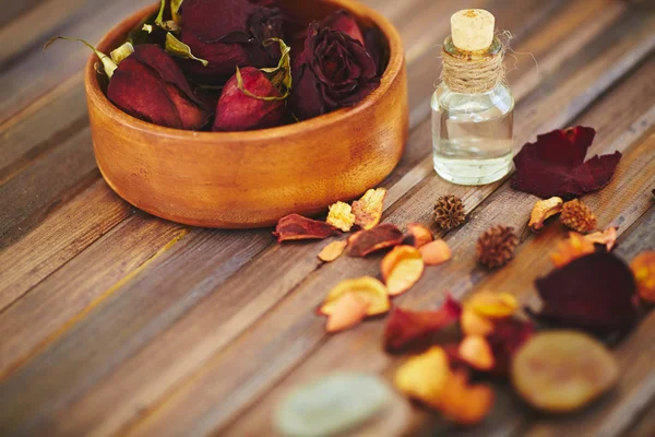 Rose petals and perfume bottle — Stok fotoğraf