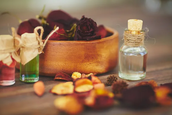 Perfume bottles and floral petals — Stok fotoğraf