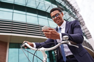 Young businessman on bicycle