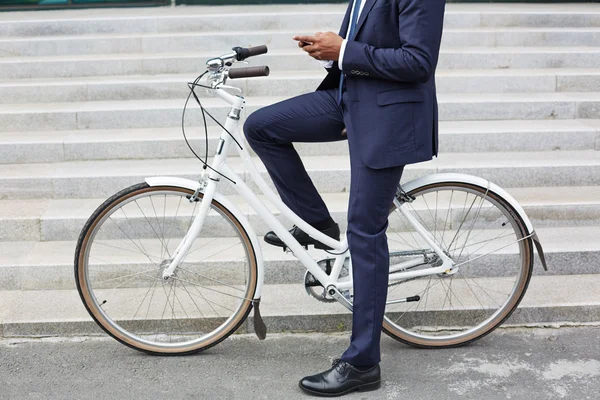 Modern businessman on bicycle — Stockfoto
