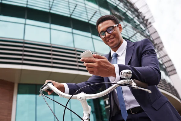 Young businessman on bicycle — Stok fotoğraf