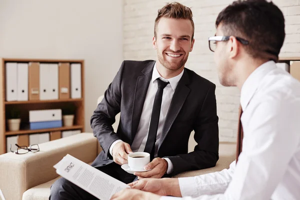 Confident businessmen interacting in office — Stock Photo, Image