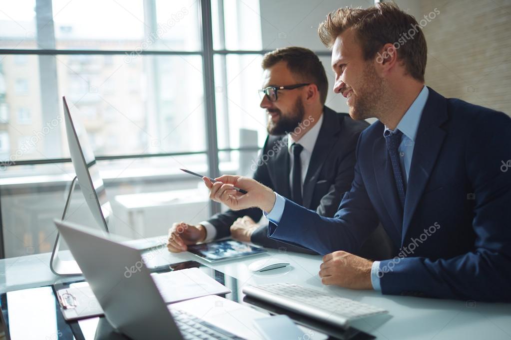 businessman consulting his colleague at meeting