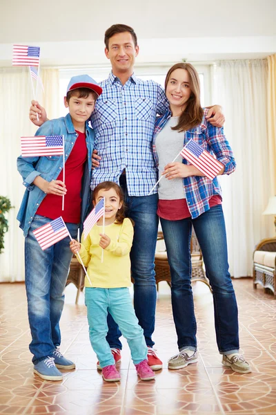 American family  holding flags — Stock Photo, Image