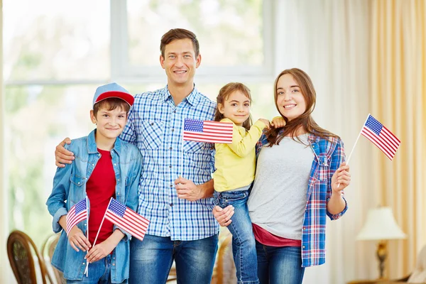 American family  holding flags — Stock Photo, Image