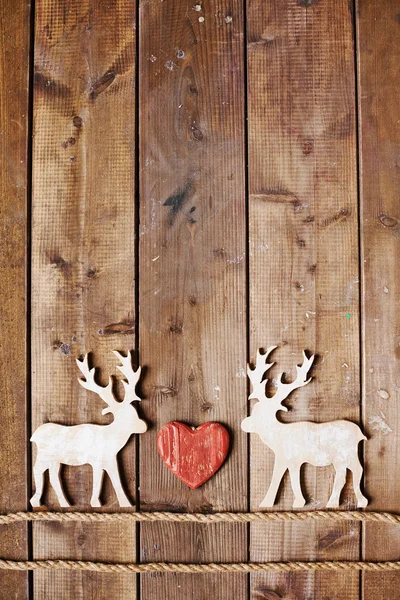 Reindeers on ropes and red heart — Stock Photo, Image