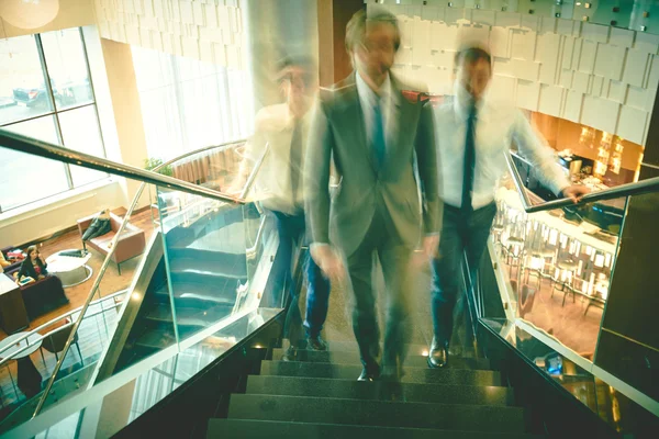 Businessmen going upstairs — Stock Photo, Image