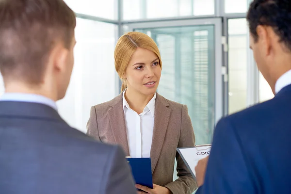 Businesswoman looking at her colleague — Stock Photo, Image