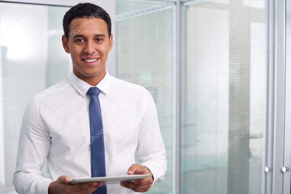 Happy businessman with touchpad