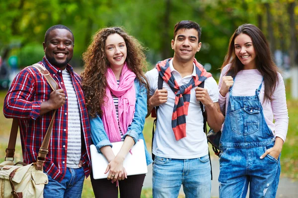 Friendly students standing in line — Stock Photo, Image