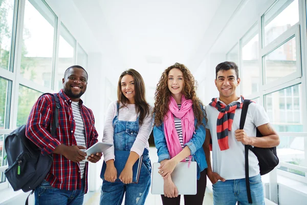 Students in college corridor — Stock Photo, Image