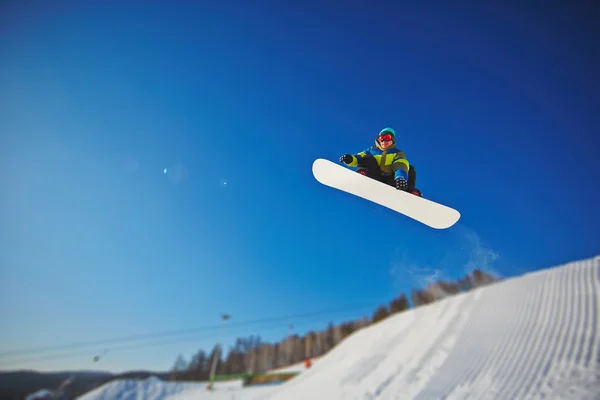 Sportsman snowboarding in winter — Stock Photo, Image