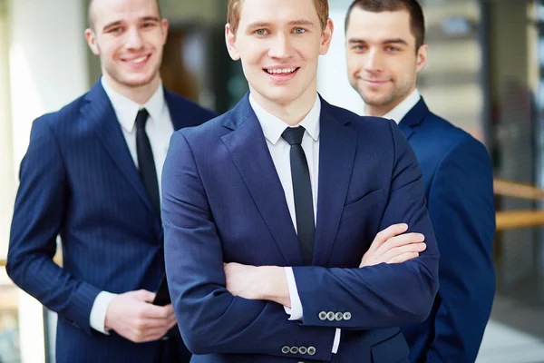 Business leader between his colleagues — Stock Photo, Image