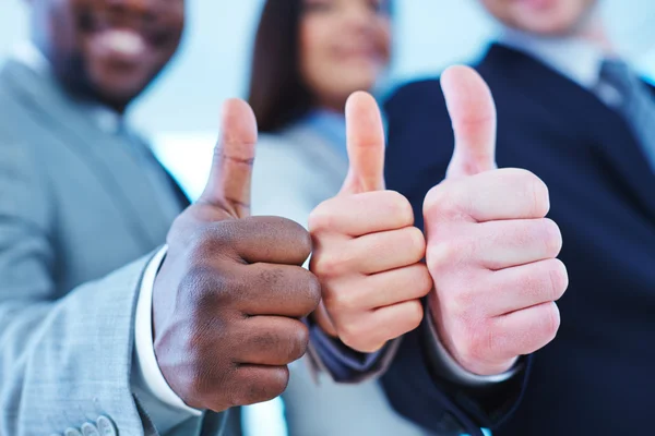 Business people showing thumbs up — Stock Photo, Image