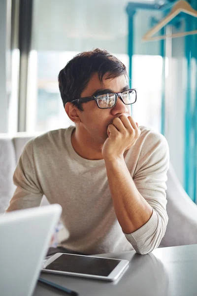 Pensive guy in eyeglasses — Stock Photo, Image