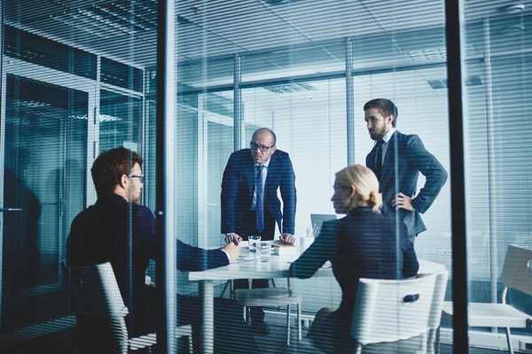 Several colleagues gathered in office — Stock Photo, Image