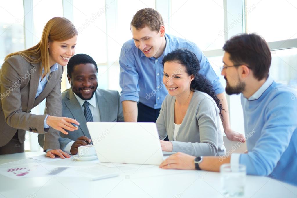 Group of employees with laptop