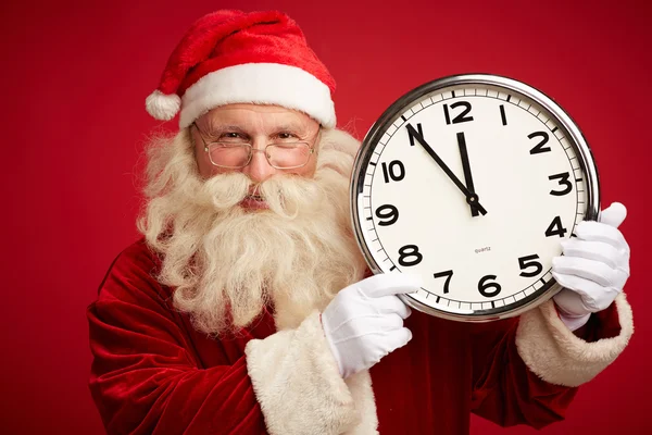 Santa Claus tonen op klok — Stockfoto