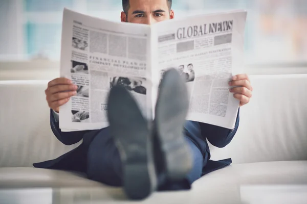 Serious businessman reading newspaper — Stock Photo, Image