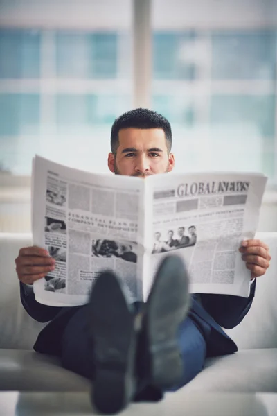 Young businessman with newspaper — Stock Photo, Image