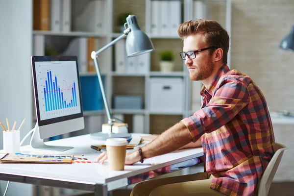 businessman looking at financial chart