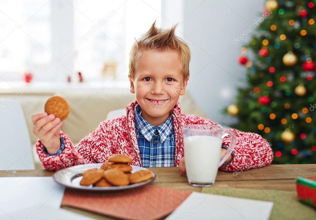 boy eating biscuits with milk