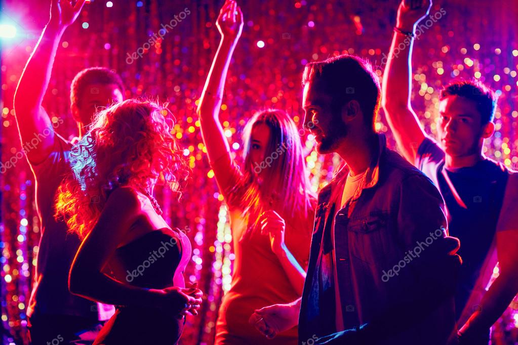Young people dancing in the night club Stock Photo by ©pressmaster 88897512