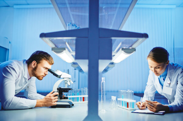 scientists working in chemistry laboratory