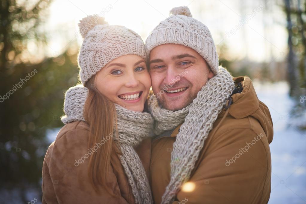 Joyful sweethearts in winter wear