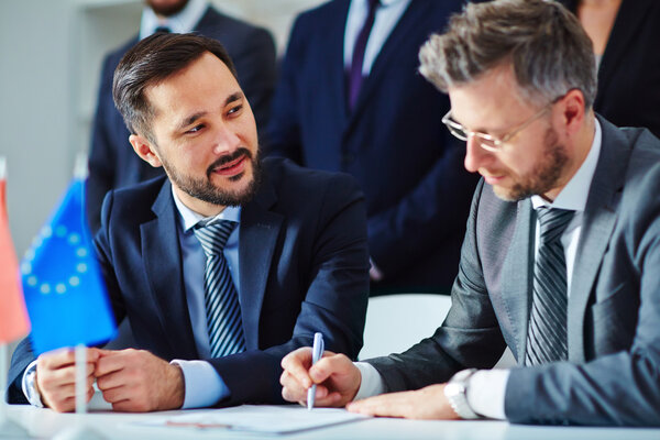 Asian businessman looking at his partner