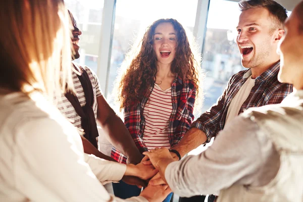 Friends making pile of hands — Stock Photo, Image