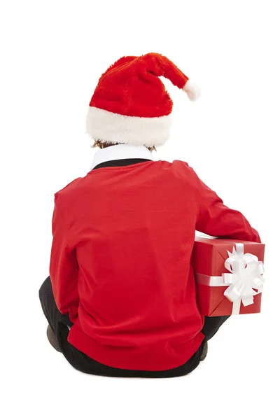 Boy in Santa cap holding gift-box — Stock Photo, Image