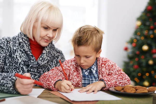 Mature woman and her grandson drawing — Stock Photo, Image