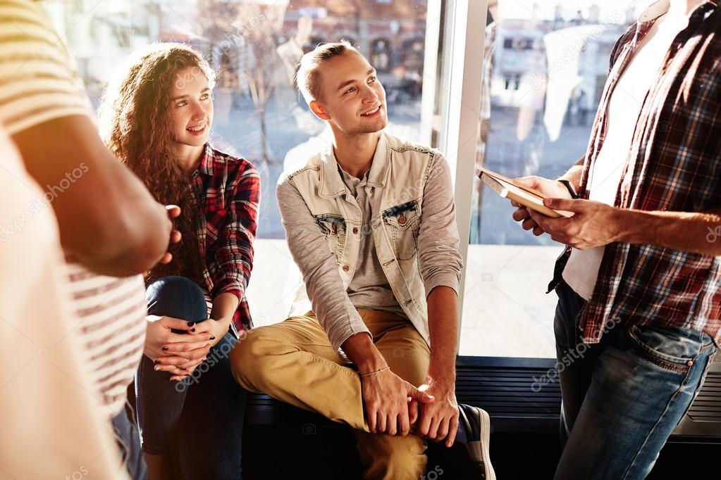 teenagers looking at their college friend