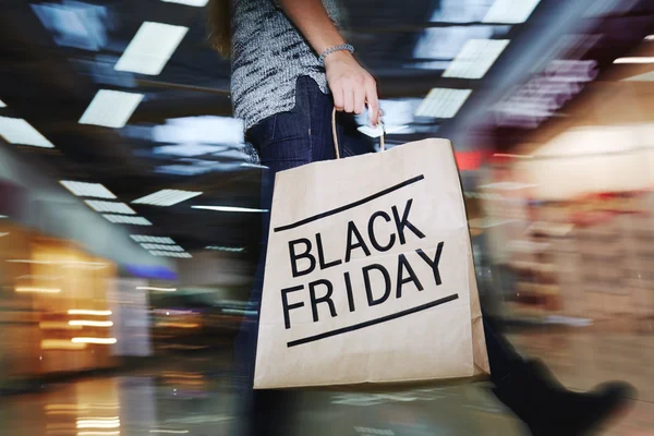 Shopper with Black Friday paperbag — Stock Photo, Image