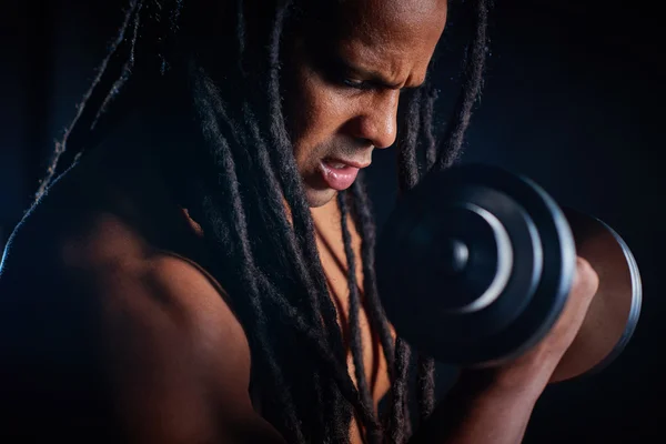 Man with barbell pumping arm muscles — Stock Photo, Image