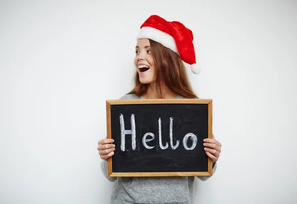 Glückliches Mädchen mit Weihnachtsmütze — Stockfoto