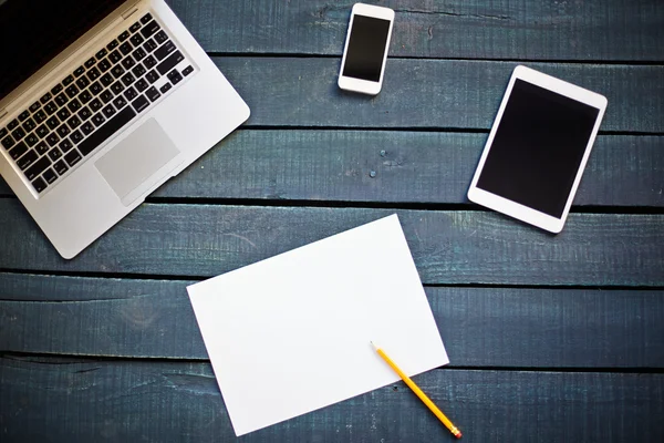 Gadgets and empty paper with pencil — Stock Photo, Image