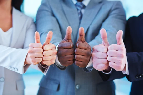 Business people showing thumbs up — Stock Photo, Image