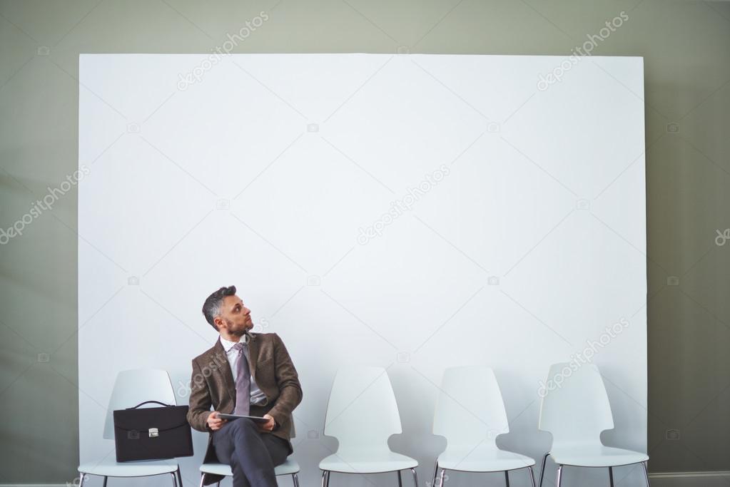 Businessman with touchpad at office