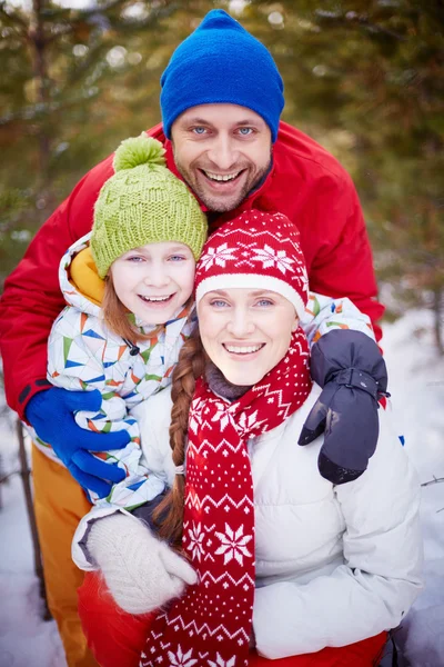 Family embracing outdoors — Stock Photo, Image