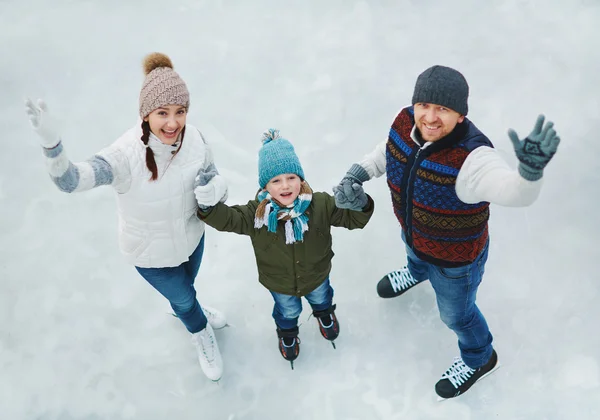 Active family on skating-rink — Stock Photo, Image