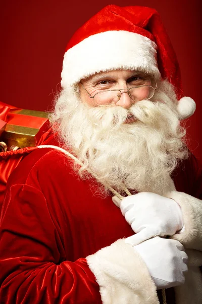 Santa claus met presenteert Stockafbeelding