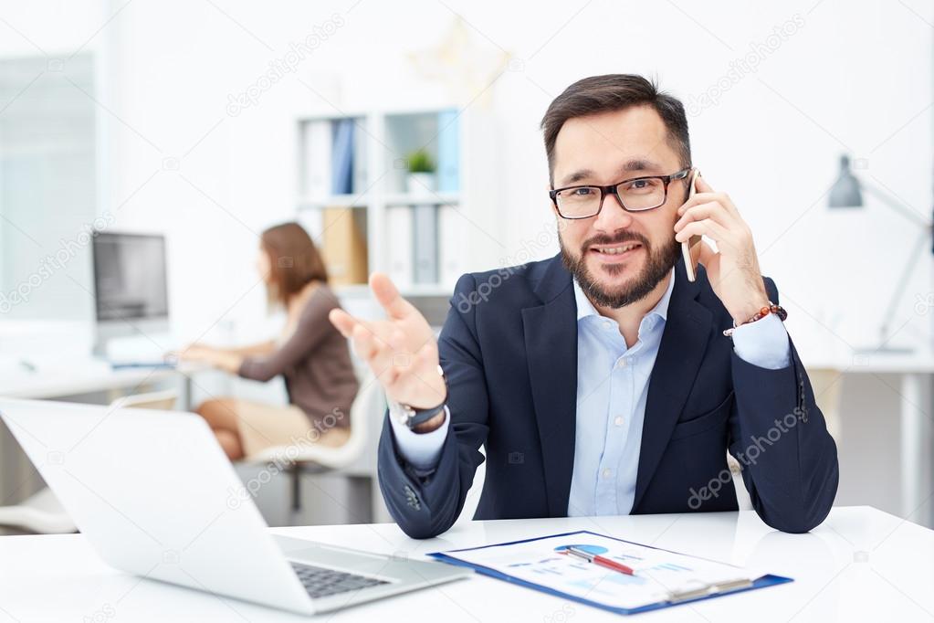 Office worker speaking on cellphone
