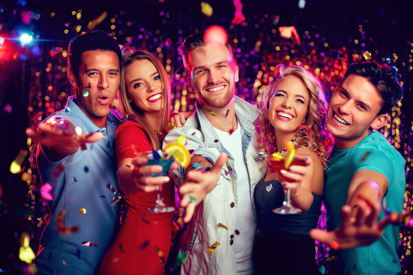 friends holding martini glasses