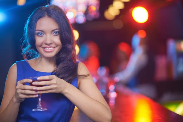 Young brunette with cocktail Royalty Free Stock Images