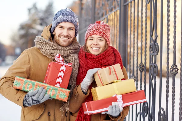 Amorous couple with gift-boxes — Stock Photo, Image