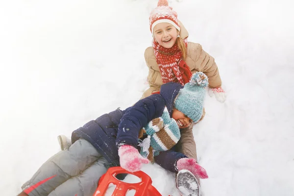 Happy girls at winter park — Stock Photo, Image
