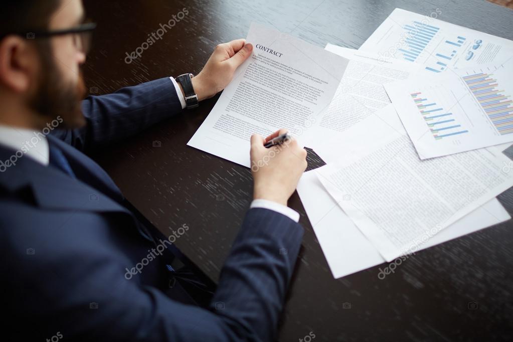 Businessman hands signing contract