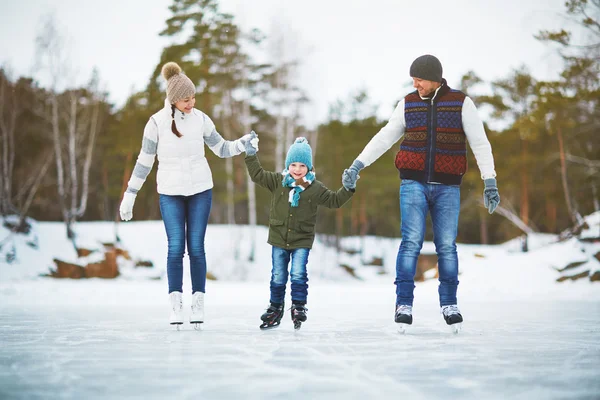 Active family skating — Stock Photo, Image